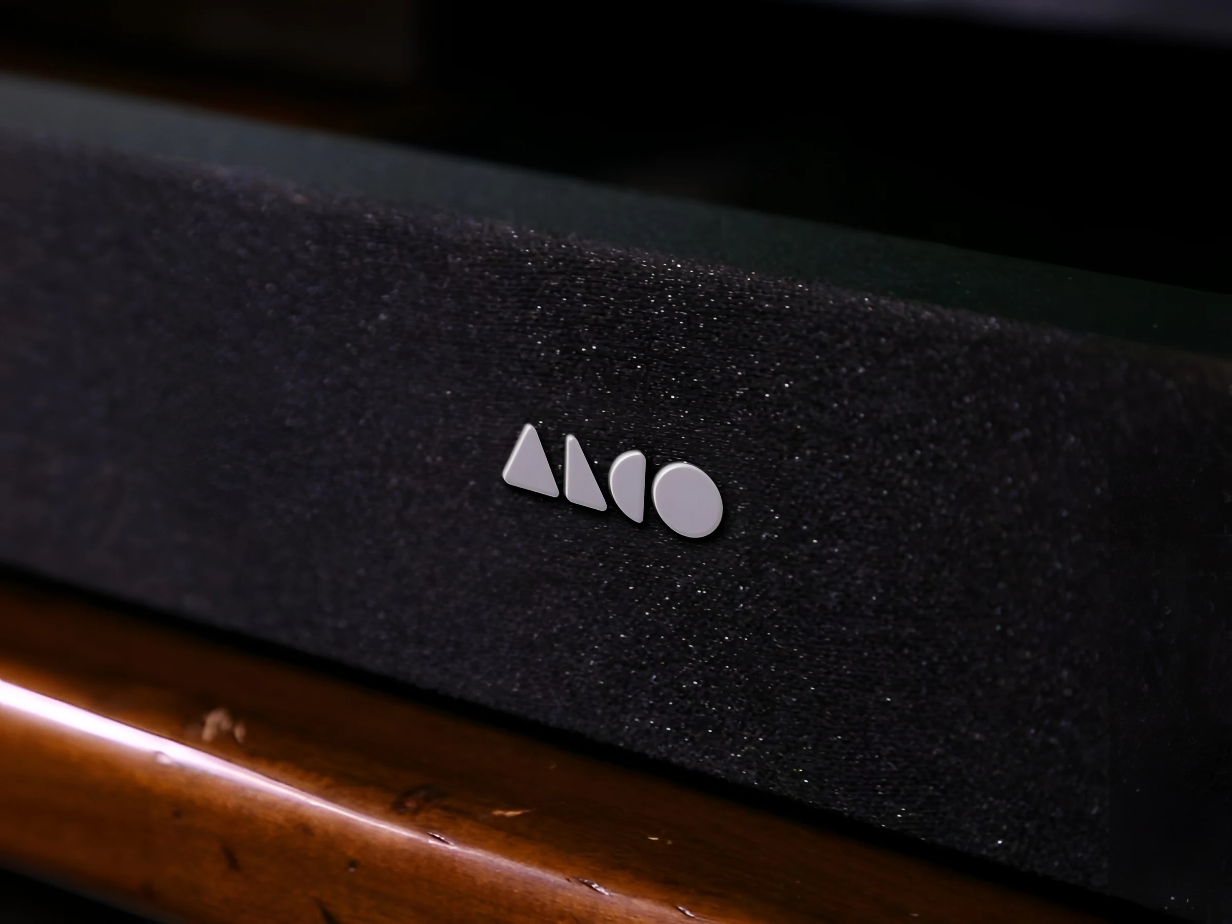 ALCO geometric wordmark engraved on matte black product hardware